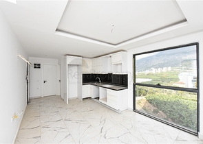 شقة 1+1 مطلة على الجبل والبحر في منطقة محمودلار شقة 1+1 مطلة على الجبل والبحر في منطقة محمودلار