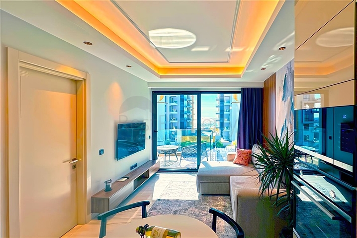 شقة 1+1 على الخط الأول في محمودلار في مجمع سكني مرموق