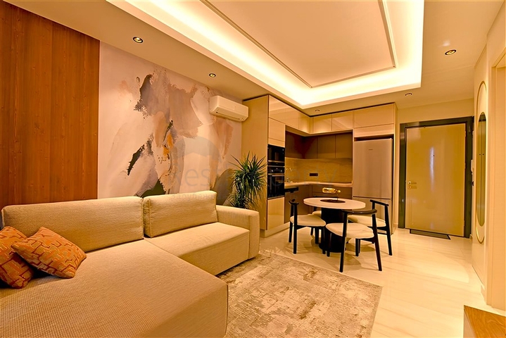 شقة 1+1 على الخط الأول في محمودلار في مجمع سكني مرموق