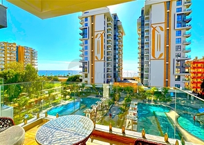 شقة 1+1 على الخط الأول في محمودلار في مجمع سكني مرموق