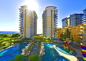 شقة 1+1 على الخط الأول في محمودلار في مجمع سكني مرموق