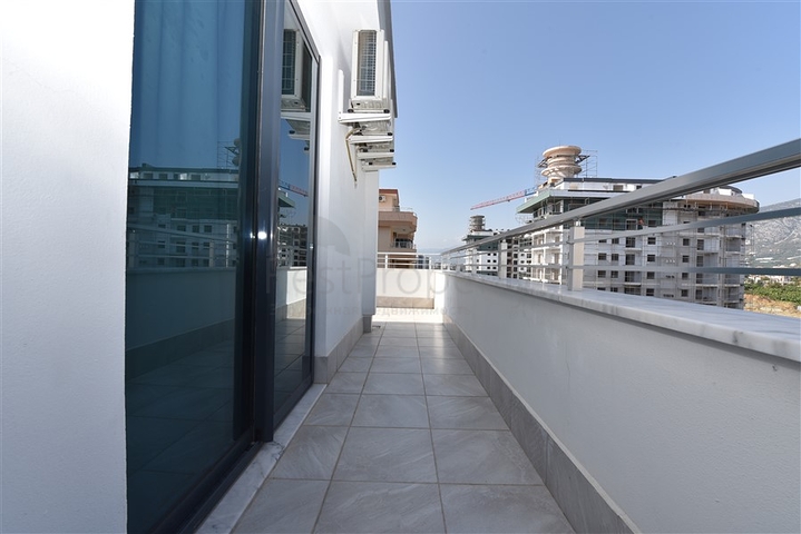 دوبلكس فاخرة ضمن مجمع حديث - قريبة من البحر / مهموتلار / الانيا 