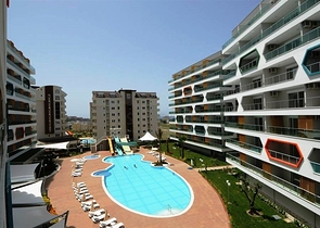 شقة غرفة وصالة ضمن مجمع سكني يضم كافة الخدمات في افسلار / الانيا 