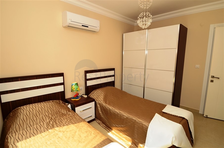 شقة مفروشة ضمن أحد المجمعات بإطلالة ساحرة على البحر الأبيض المتوسط في منطقة محمود لار – ألانيا