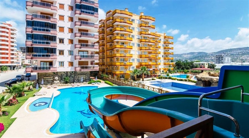 شقة مفروشة ضمن أحد المجمعات بإطلالة ساحرة على البحر الأبيض المتوسط في منطقة محمود لار – ألانيا