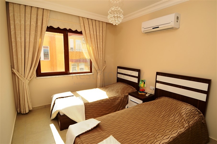 شقة مفروشة ضمن أحد المجمعات بإطلالة ساحرة على البحر الأبيض المتوسط في منطقة محمود لار – ألانيا