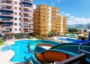 شقة مفروشة ضمن أحد المجمعات بإطلالة ساحرة على البحر الأبيض المتوسط في منطقة محمود لار – ألانيا