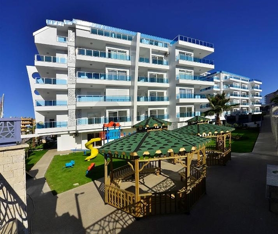 شقة بتخطيط 2+1 مع حديقة ضمن أحد المجمعات الرائعة في منطقة أفسلار – ألانيا