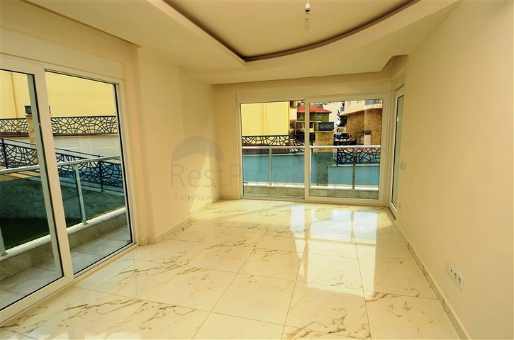 شقة بتخطيط 2+1 مع حديقة ضمن أحد المجمعات الرائعة في منطقة أفسلار – ألانيا