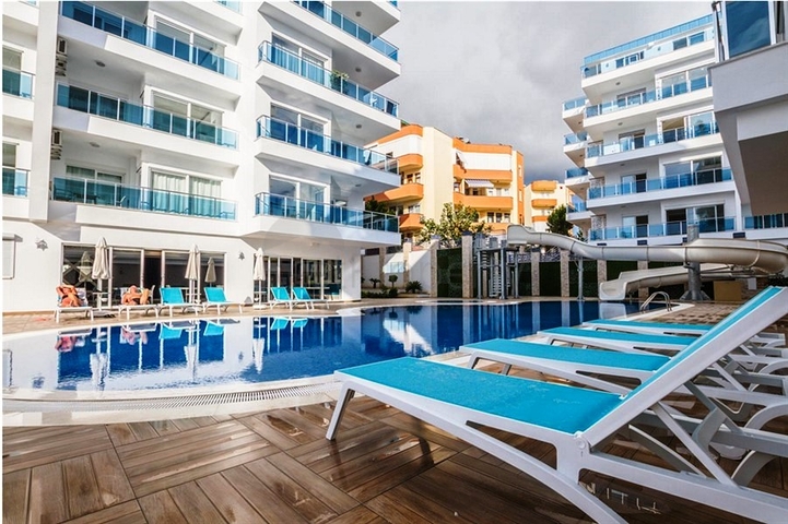 شقة بتخطيط 2+1 مع حديقة ضمن أحد المجمعات الرائعة في منطقة أفسلار – ألانيا