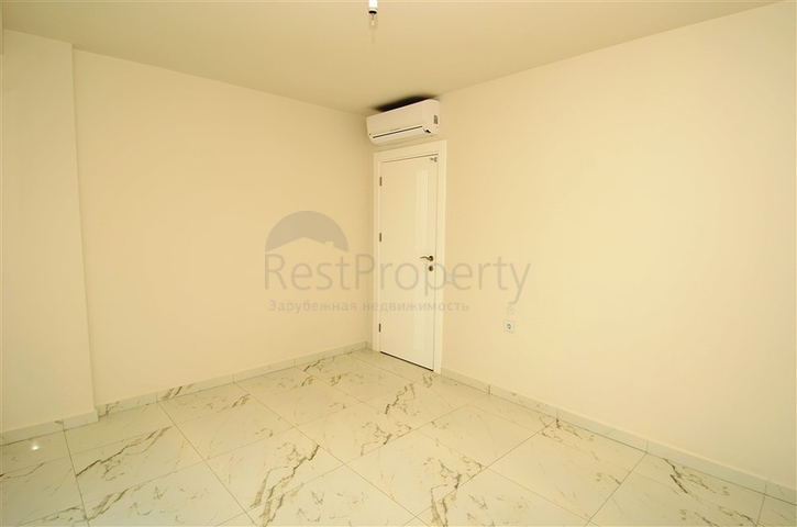 شقة بتخطيط 2+1 مع حديقة ضمن أحد المجمعات الرائعة في منطقة أفسلار – ألانيا