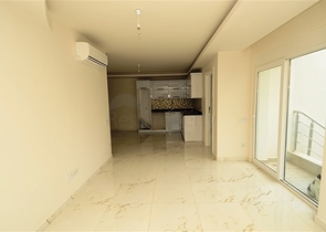 شقة بتخطيط 2+1 مع حديقة ضمن أحد المجمعات الرائعة في منطقة أفسلار – ألانيا