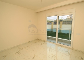 شقة بتخطيط 2+1 مع حديقة ضمن أحد المجمعات الرائعة في منطقة أفسلار – ألانيا