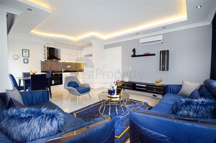 شقة بغرفة نوم وصالة ضمن مجمع مريح في منطقة محمودلار- ألانيا.