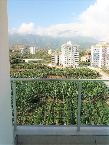 شقة بغرفة نوم وصالة ضمن مجمع مريح في منطقة محمودلار- ألانيا.