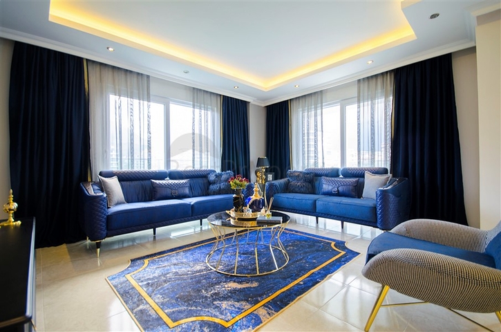 شقة بغرفة نوم وصالة ضمن مجمع مريح في منطقة محمودلار- ألانيا.