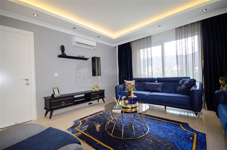 شقة بغرفة نوم وصالة ضمن مجمع مريح في منطقة محمودلار- ألانيا.