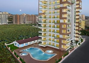 شقة بغرفة نوم وصالة ضمن مجمع مريح في منطقة محمودلار- ألانيا.