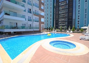 شقة بغرفة نوم وصالة ضمن مجمع مريح في منطقة محمودلار- ألانيا.