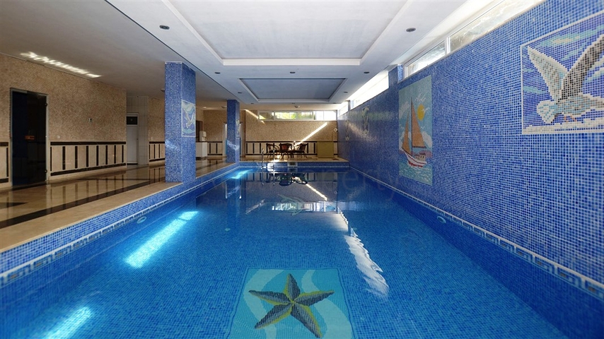 شقة واسعة ضمن مجمع سكني في منطقة ماهموت لار – ألانيا .