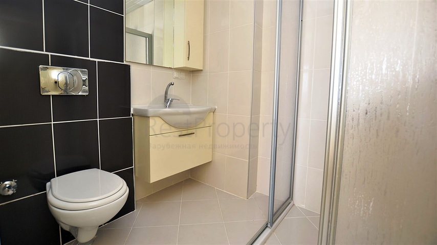 شقة واسعة ضمن مجمع سكني في منطقة ماهموت لار – ألانيا .