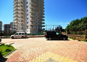 شقة واسعة ضمن مجمع سكني في منطقة ماهموت لار – ألانيا .