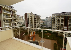 شقة ضمن مجمع سكني رائع في منطقة أفسلار – ألانيا .