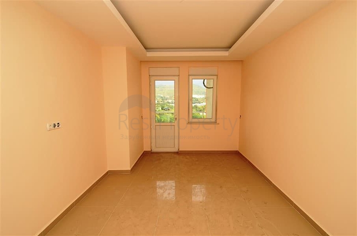 شقة بإطلالة جبلية مذهلة في منطقة ماهموت لار – ألانيا.