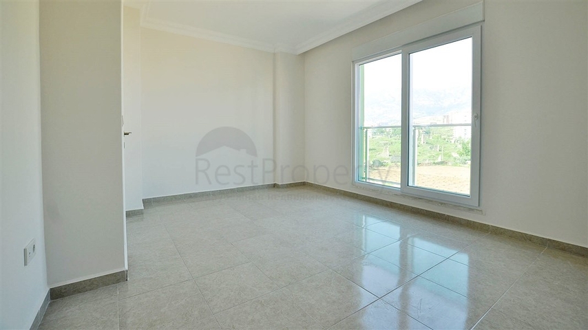 شقة بإطلالة جبلية ضمن مجمع حديث في منطقة محمود لار – ألانيا 