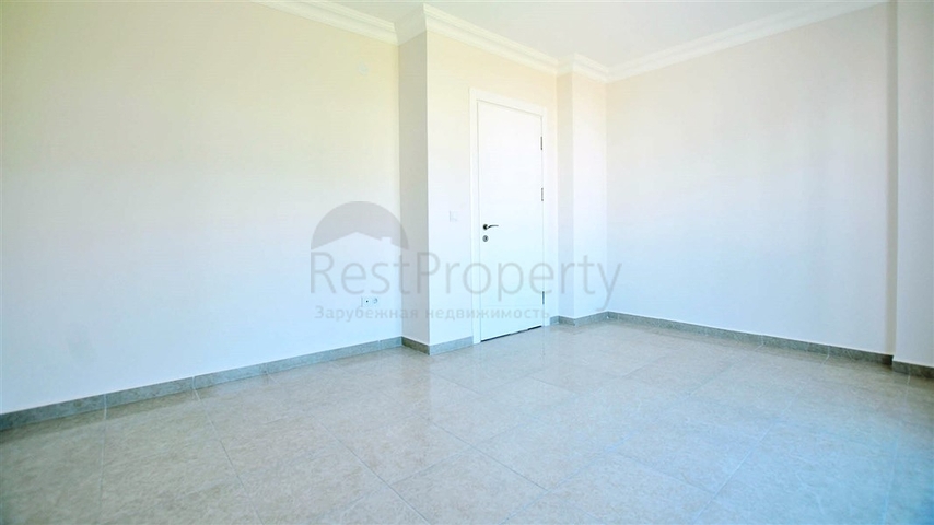 شقة بإطلالة جبلية ضمن مجمع حديث في منطقة محمود لار – ألانيا 