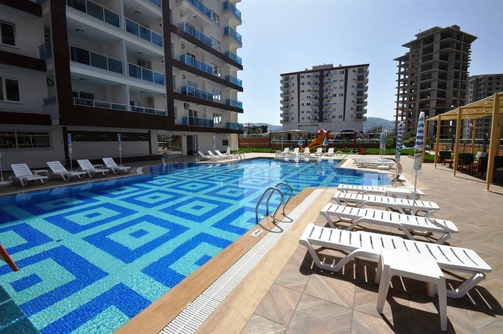 شقة ضمن مجمع سكني حديث في منطقة محمود لار – ألانيا