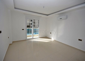 شقة ضمن مجمع سكني حديث في منطقة محمود لار – ألانيا