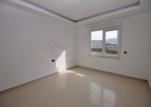 شقة ضمن مجمع سكني حديث في منطقة محمود لار – ألانيا