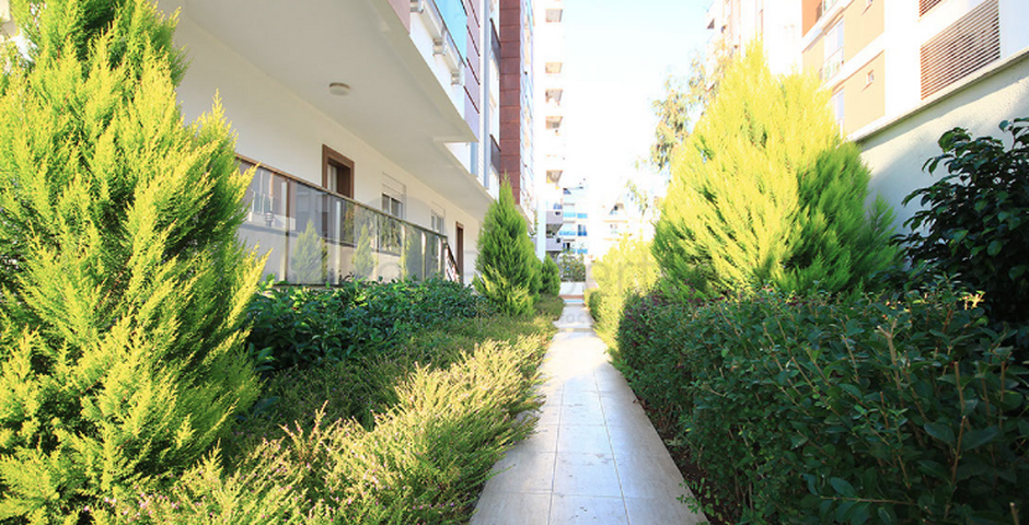 شقة ضمن مجمع سكني مميز في حي ليمان من منطقة كونيالتي – أنطاليا