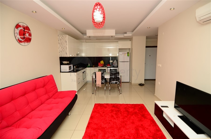 شقة ضمن مجمع مع بنية تحتية ممتازة في منطقة جيكجيلي – ألانيا 