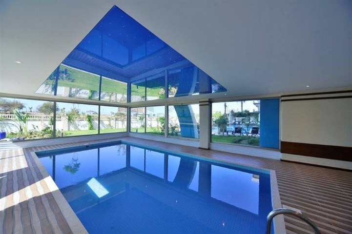 شقة ضمن مجمع سكني على الخط الأول من البحر في منطقة محمود لار – ألانيا