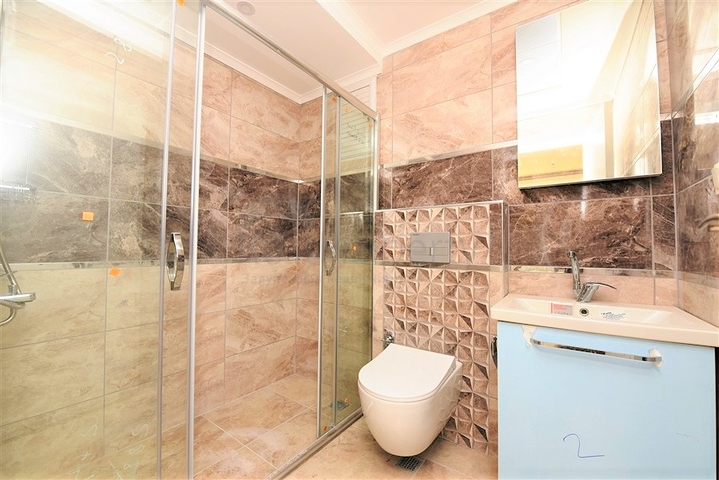 شقة جديدة للبيع في مركز الانيا _ من تصميم غرفتين وصالة 