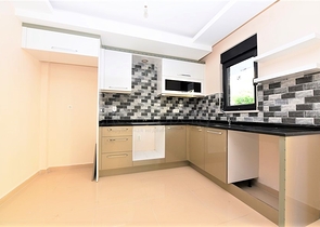 شقة جديدة للبيع في مركز الانيا _ من تصميم غرفتين وصالة 