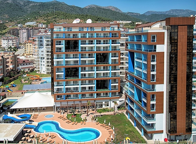 غرفة نوم وصالة ضمن مجمع سكني جانب مركز التسوق في جيكجيلي _ الانيا 