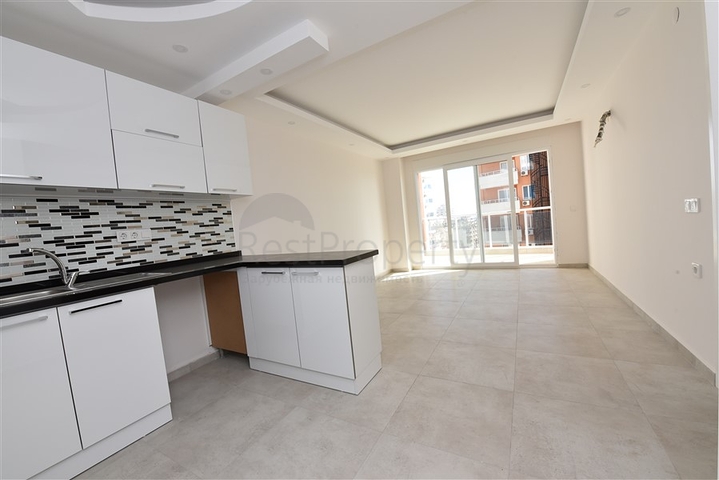 شقة للبيع في الانيا - من تصميم غرفة نوم وصالة ضمن مجمع سكني في مهموتلار 