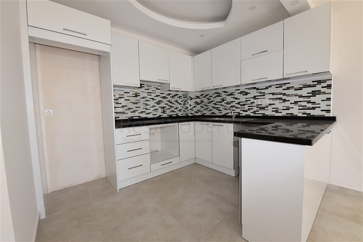 شقة للبيع في الانيا - من تصميم غرفة نوم وصالة ضمن مجمع سكني في مهموتلار 