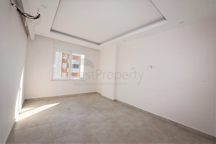 شقة للبيع في الانيا - من تصميم غرفة نوم وصالة ضمن مجمع سكني في مهموتلار 