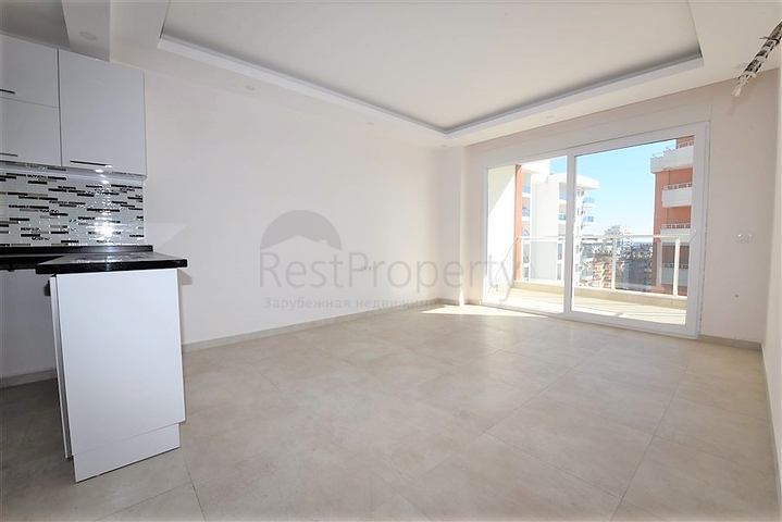 شقة للبيع في الانيا - من تصميم غرفة نوم وصالة ضمن مجمع سكني في مهموتلار 