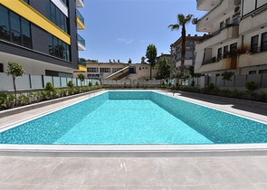 شقة غرفتين وصالة ومطبخ منفصل -ضمن مجمع سكني حديث في مركز الانيا 