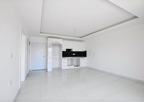 شقة بتصميم غرفة وصالة ضمن مجمع سكني حديث في مهموتلار - الانيا