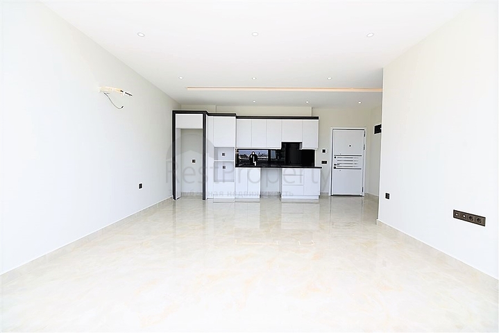 ضمن مجمع سكني حديث بأول خط على البحر - غرفة نوم وصالة في مهموتلار -الانيا 