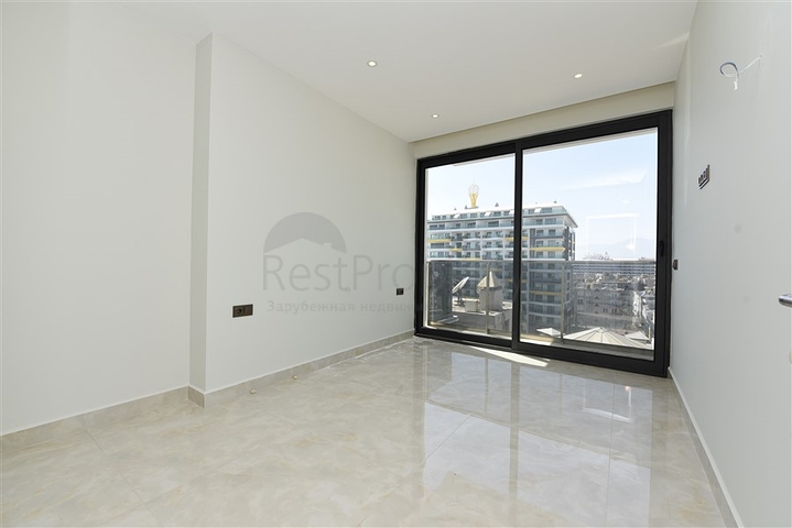 ضمن مجمع سكني حديث بأول خط على البحر - غرفة نوم وصالة في مهموتلار -الانيا 