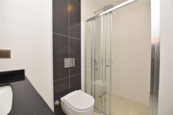 ضمن مجمع سكني حديث بأول خط على البحر - غرفة نوم وصالة في مهموتلار -الانيا 