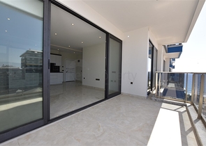 ضمن مجمع سكني حديث بأول خط على البحر - غرفة نوم وصالة في مهموتلار -الانيا 