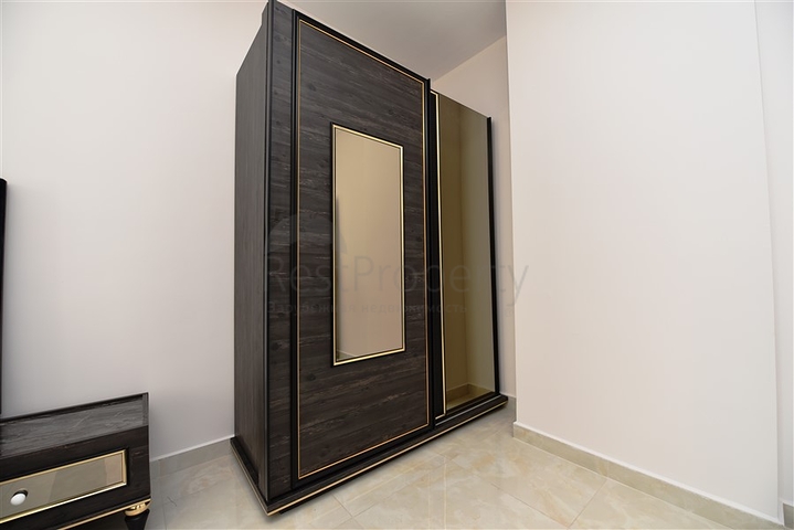 شقة بتصميم غرفتين وصالة  - ضمن مجمع حديث في مهموتلار 